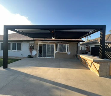 Custom patio cover with integrated lighting and fans