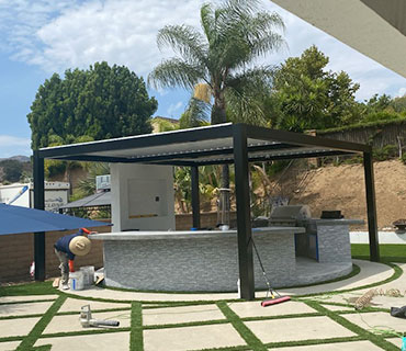 Free standing patio cover with privacy walls and outdoor furniture